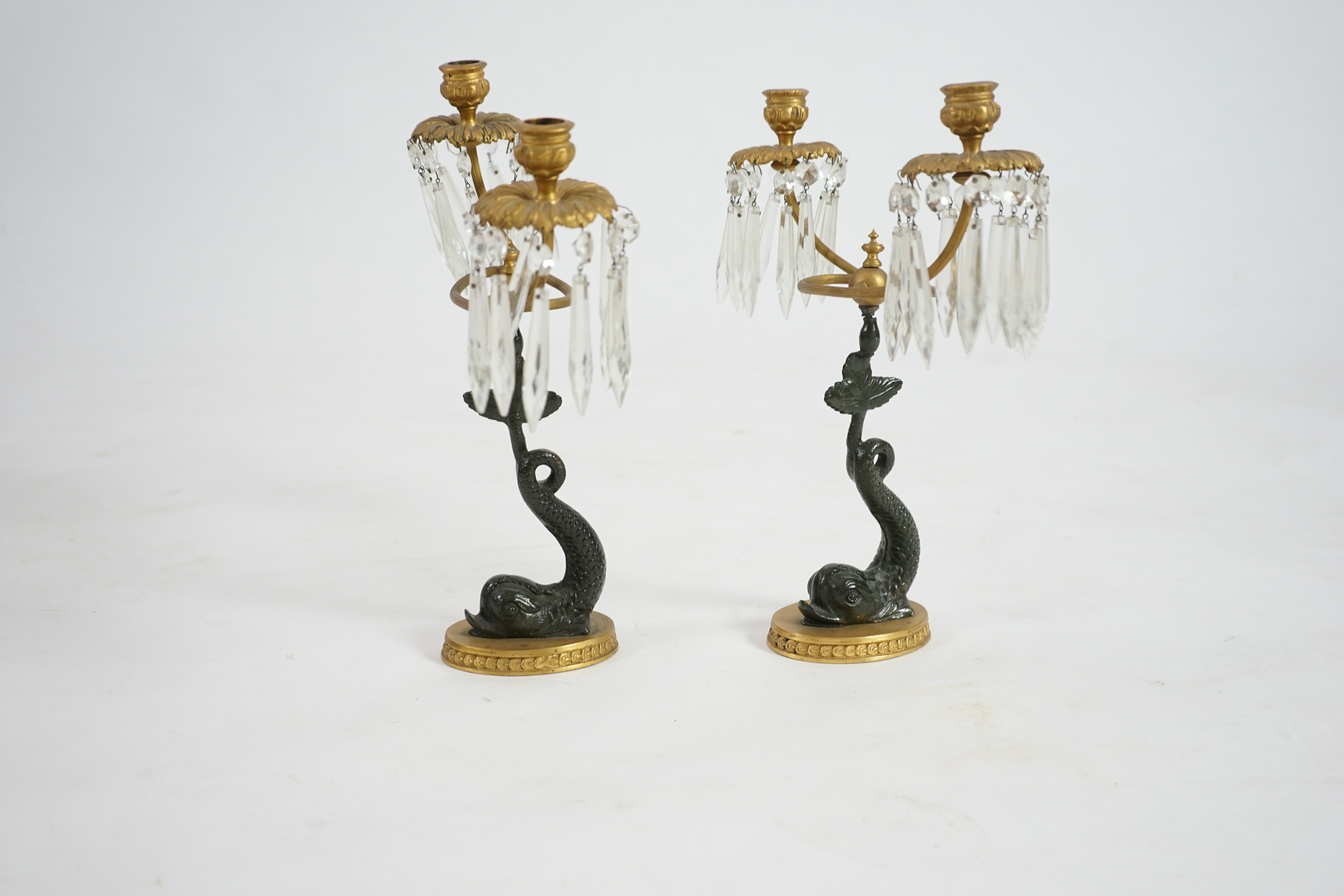 A pair of 19th century bronze and ormolu twin sconce candelabra